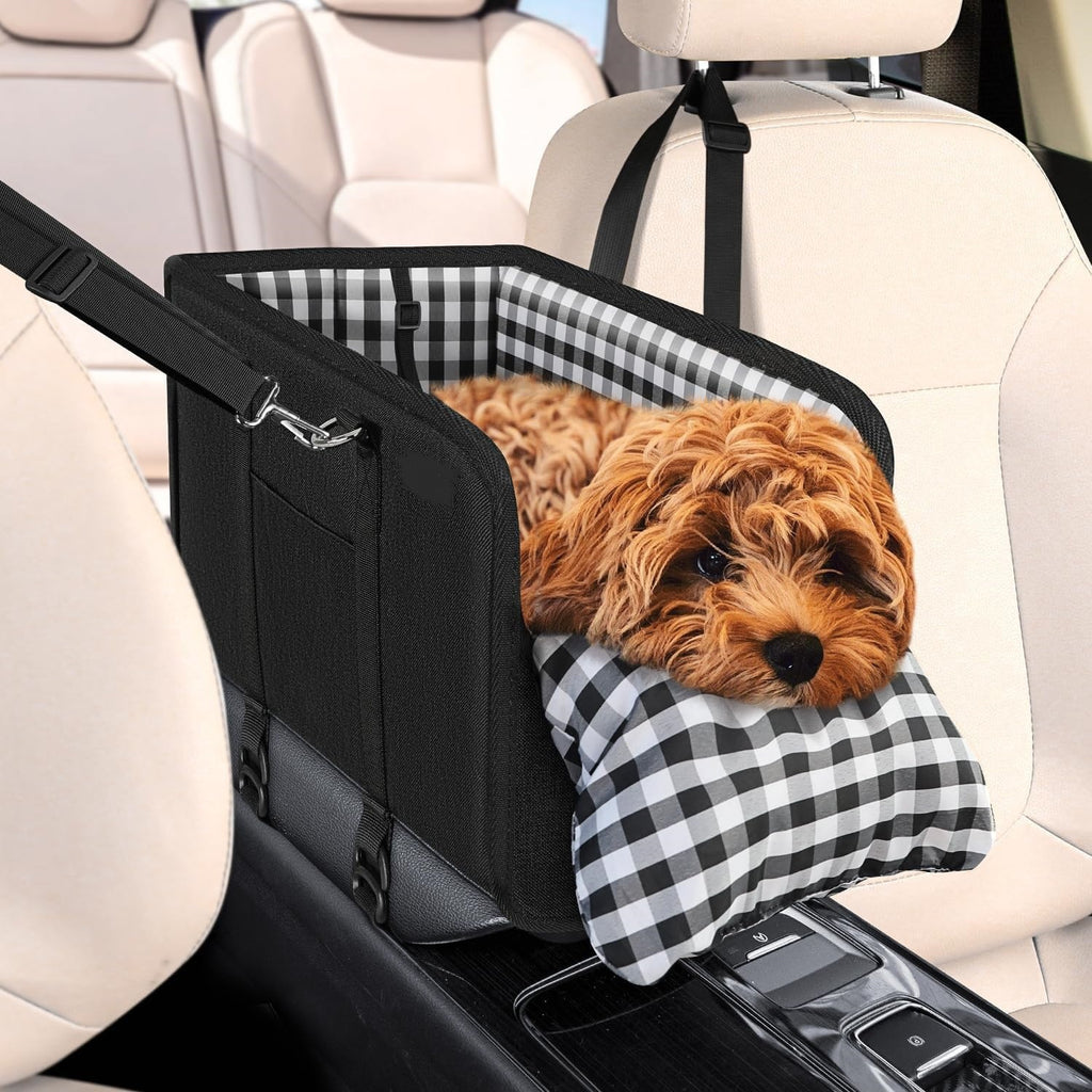 Black center console dog car seat with a small dog resting inside, fitted between the front seats