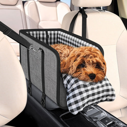 Grey center console dog car seat with a small dog resting inside